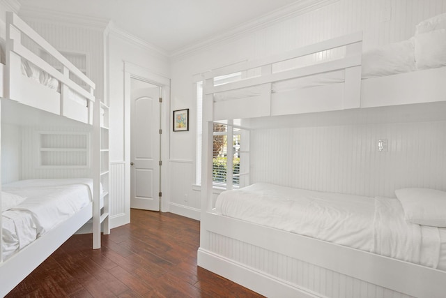 bedroom with hardwood / wood-style flooring and crown molding