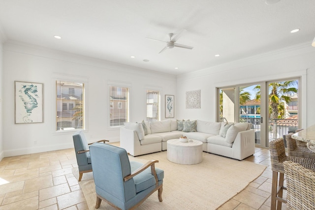 living room with ornamental molding, recessed lighting, baseboards, and stone tile floors