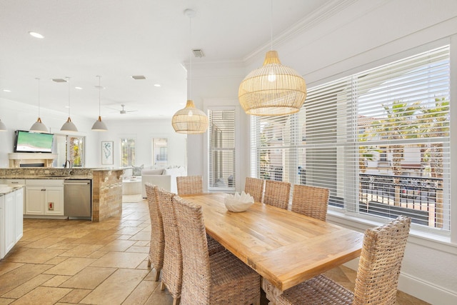 dining room featuring ornamental molding, recessed lighting, visible vents, and stone tile floors