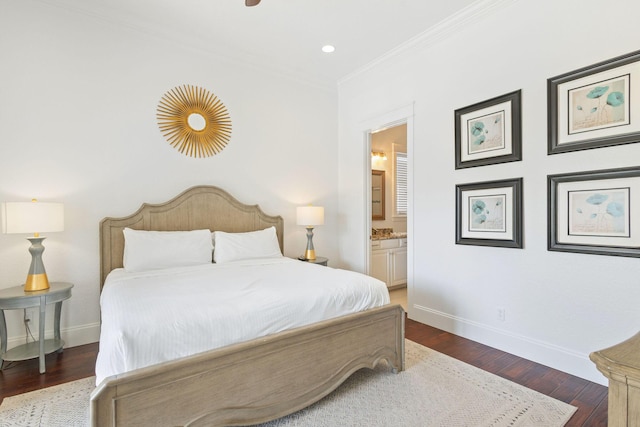 bedroom with ornamental molding, wood finished floors, and baseboards