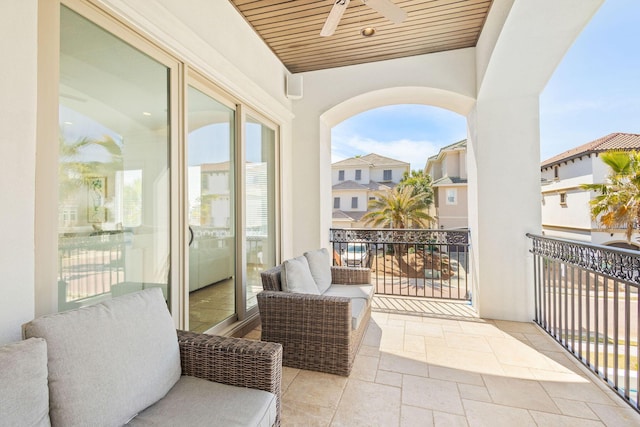 balcony featuring a ceiling fan and a sunroom