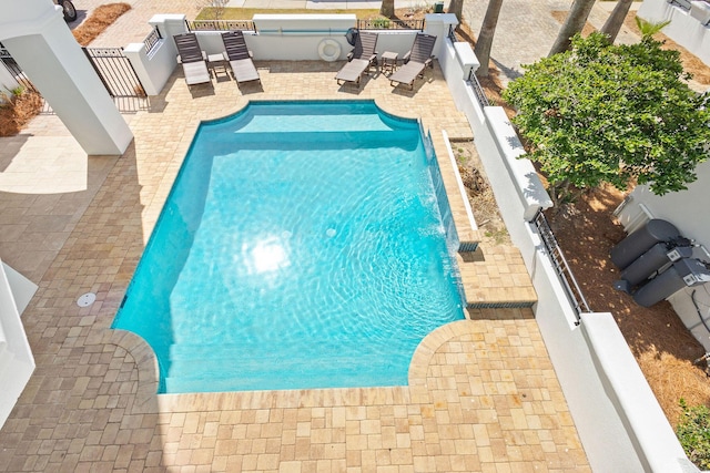 view of pool featuring a fenced in pool, a patio area, and a fenced backyard