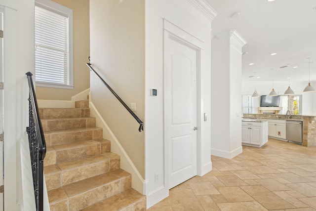 staircase featuring recessed lighting, baseboards, and stone tile floors