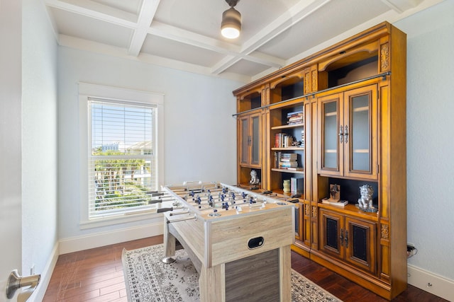 playroom featuring dark wood-style floors, beam ceiling, coffered ceiling, and baseboards