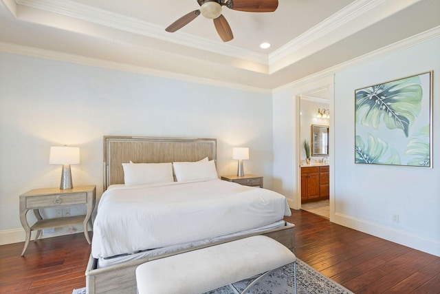 bedroom with baseboards, dark wood finished floors, connected bathroom, and ornamental molding