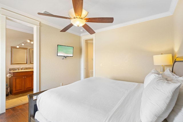 bedroom with a sink, ensuite bath, dark wood finished floors, and crown molding