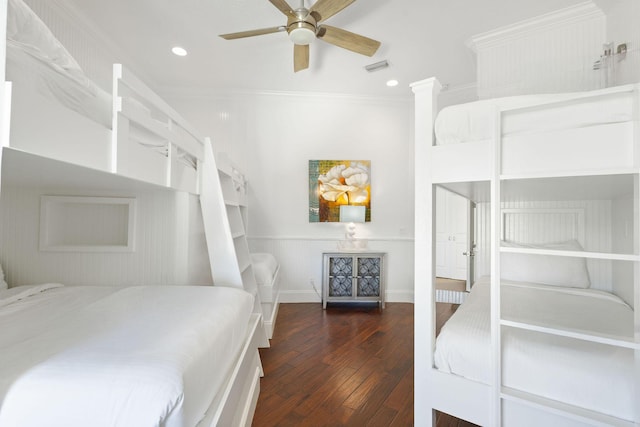 bedroom with crown molding, recessed lighting, wood-type flooring, visible vents, and baseboards