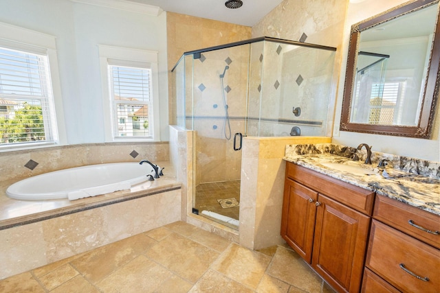 full bathroom with a garden tub, a shower stall, crown molding, and vanity