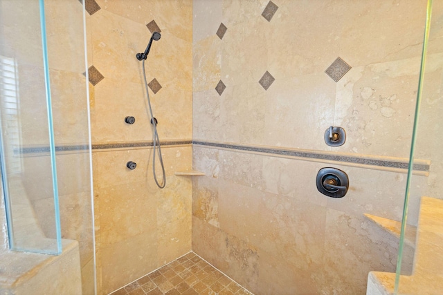 full bathroom with tiled shower