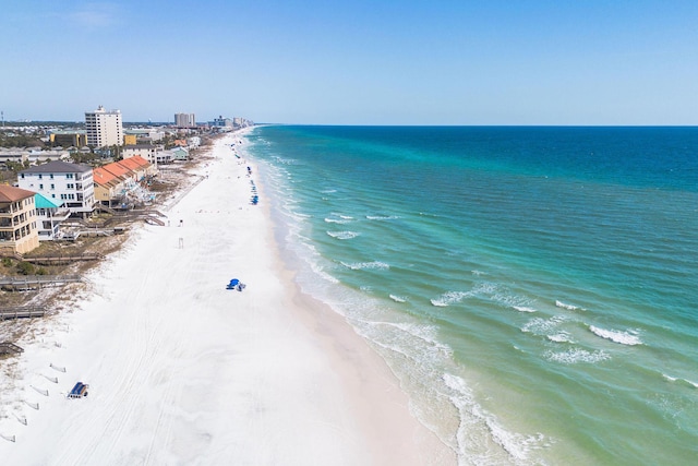 drone / aerial view with a water view and a view of the beach