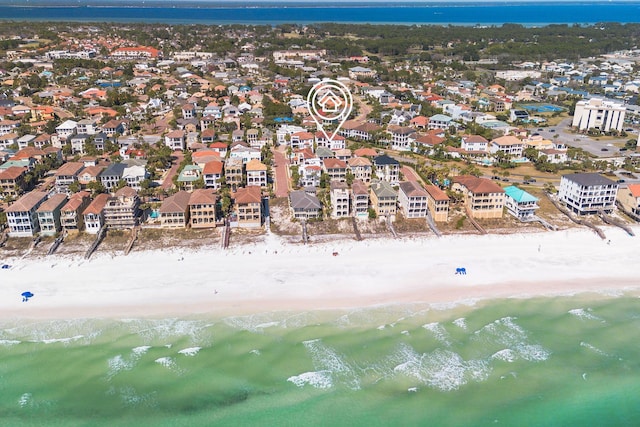 bird's eye view with a water view, a residential view, and a view of the beach