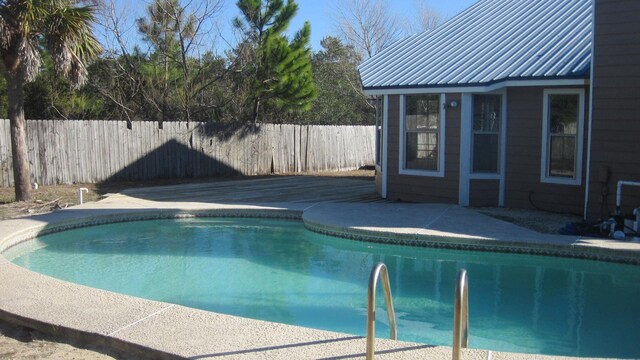 view of pool with a fenced backyard and a fenced in pool