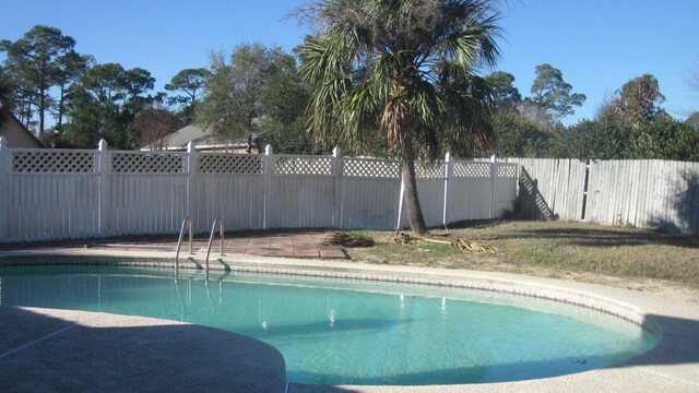 view of pool featuring a fenced in pool and fence