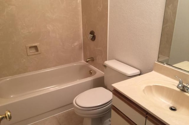 full bath with tile patterned floors, toilet, tub / shower combination, vanity, and a textured wall