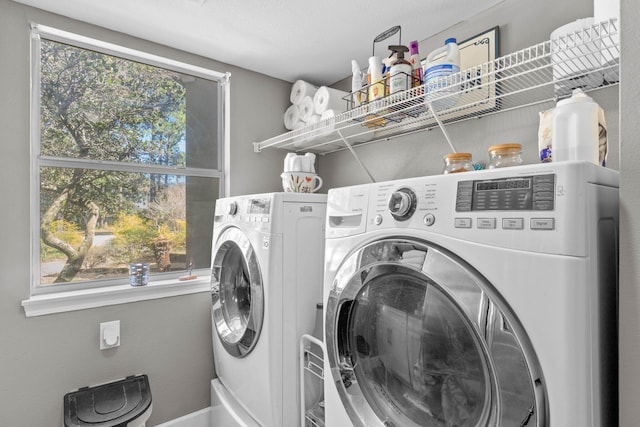 washroom featuring washer and dryer and laundry area