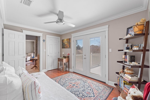 bedroom with visible vents, french doors, wood finished floors, and access to outside