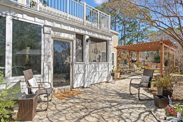 view of patio / terrace featuring a balcony and a pergola