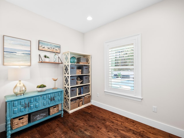 interior space featuring dark wood finished floors, recessed lighting, and baseboards