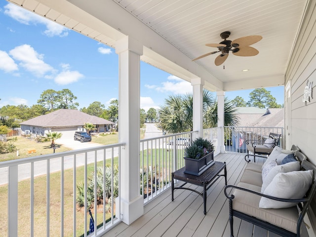 wooden terrace with a ceiling fan