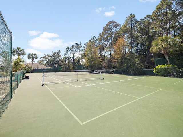 view of sport court with community basketball court and fence