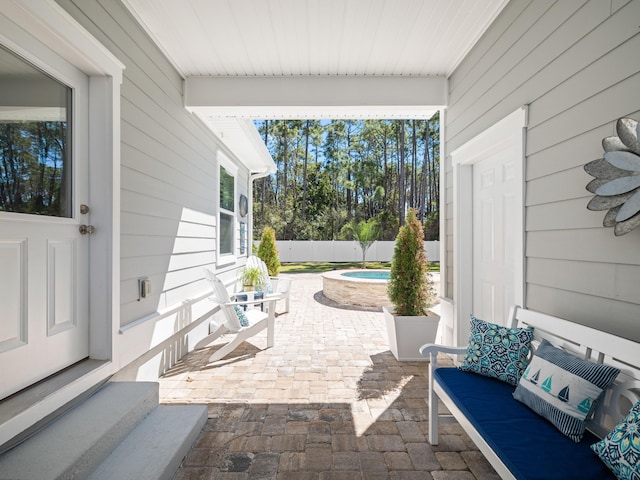 view of patio featuring fence