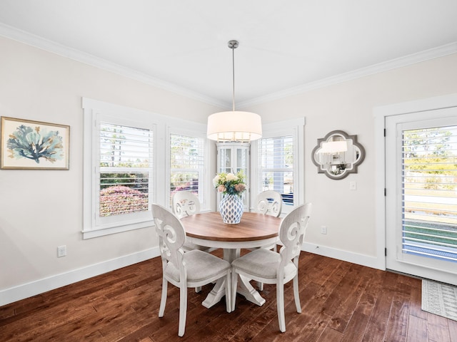 dining area with dark wood-style floors, crown molding, and baseboards