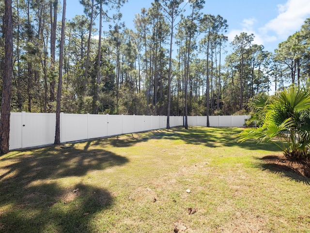 view of yard with a fenced backyard