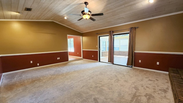 empty room featuring carpet, crown molding, visible vents, wood ceiling, and vaulted ceiling