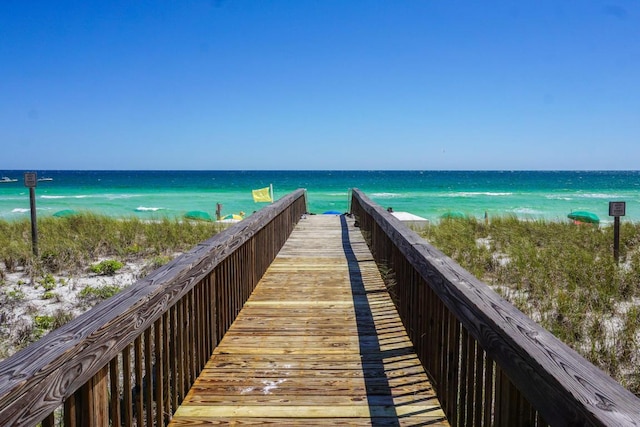 view of home's community featuring a view of the beach and a water view