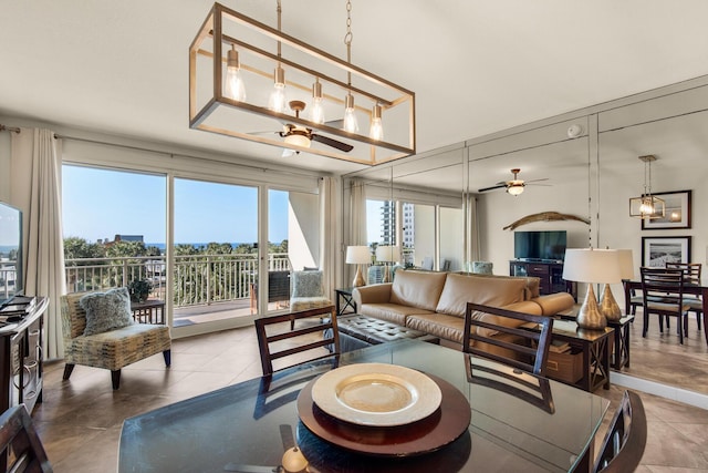 living area featuring a ceiling fan and tile patterned floors