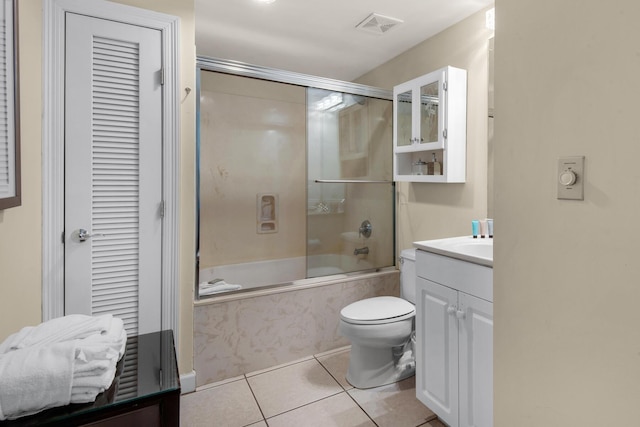 full bath featuring enclosed tub / shower combo, toilet, vanity, visible vents, and tile patterned floors