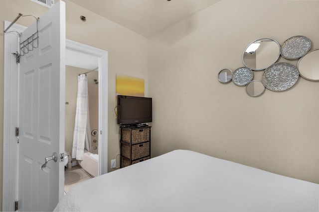 bedroom with tile patterned flooring and ensuite bathroom