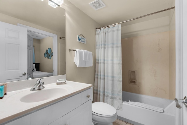 bathroom featuring toilet, vanity, visible vents, and shower / tub combo with curtain