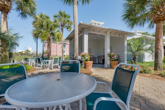 view of patio with outdoor dining space and grilling area