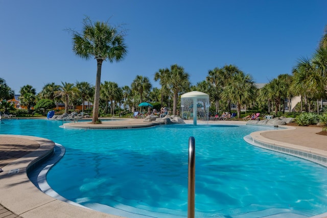 community pool with a patio area