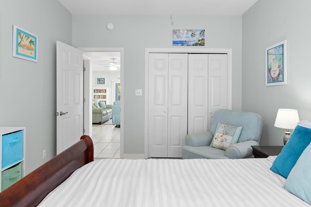 bedroom with tile patterned flooring and a closet