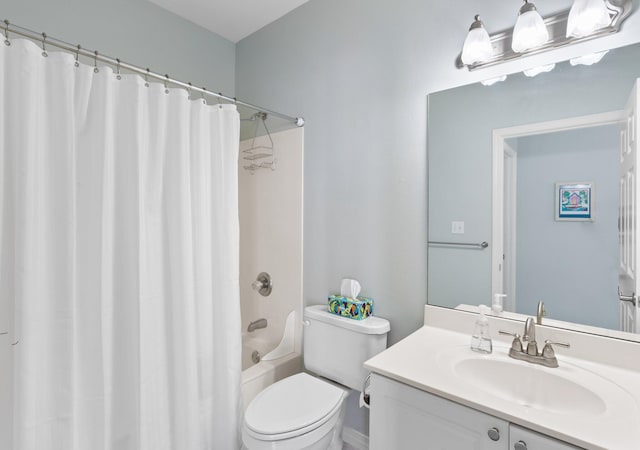 bathroom featuring shower / bathtub combination with curtain, vanity, and toilet