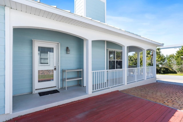 property entrance with covered porch