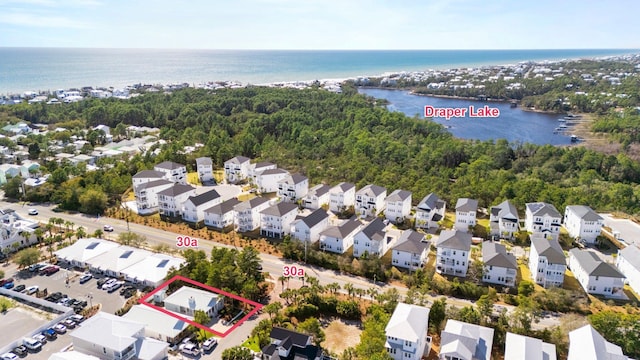 bird's eye view with a water view and a residential view