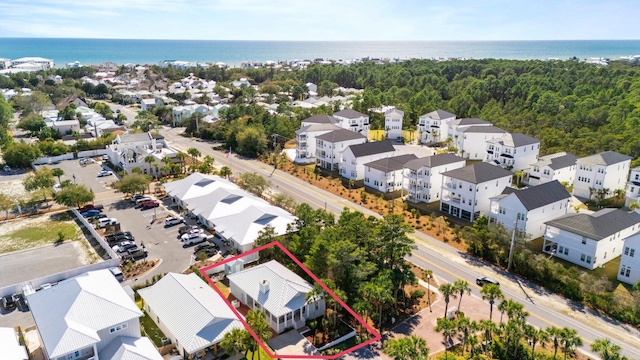 drone / aerial view with a water view and a residential view