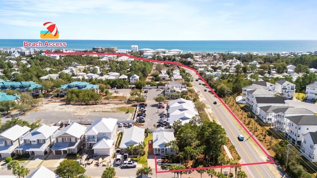 drone / aerial view featuring a water view and a residential view