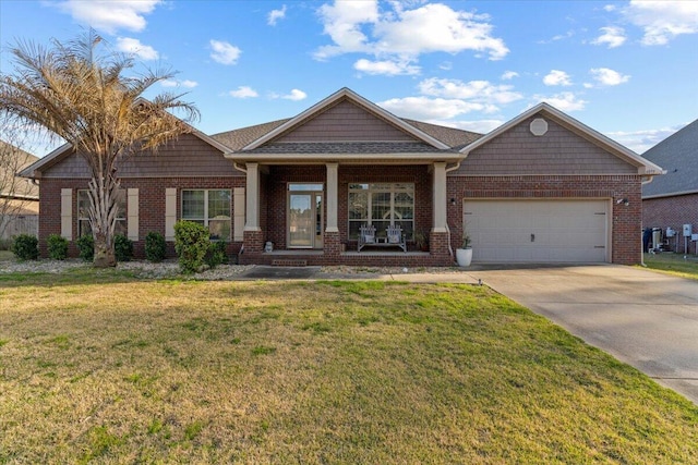 craftsman inspired home with an attached garage, driveway, a front lawn, and brick siding