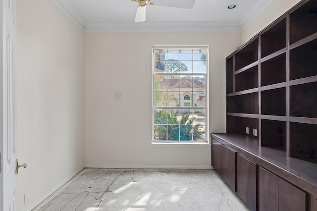 empty room with crown molding and ceiling fan