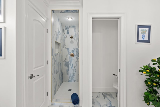 full bath with toilet, baseboards, marble finish floor, and a marble finish shower