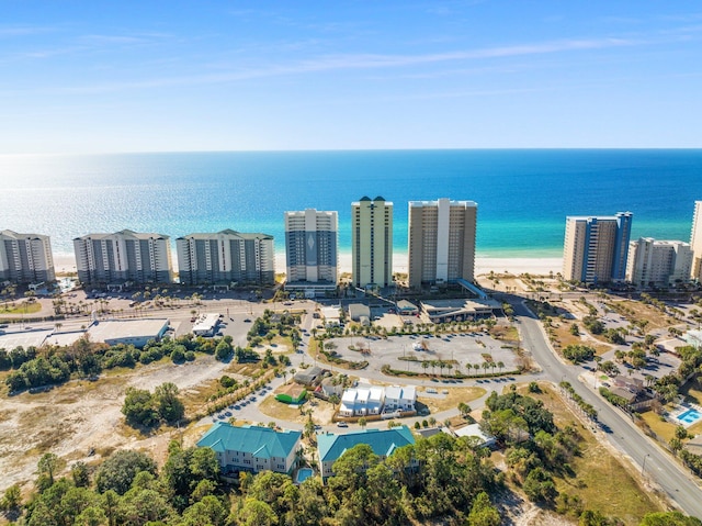 birds eye view of property with a view of city and a water view