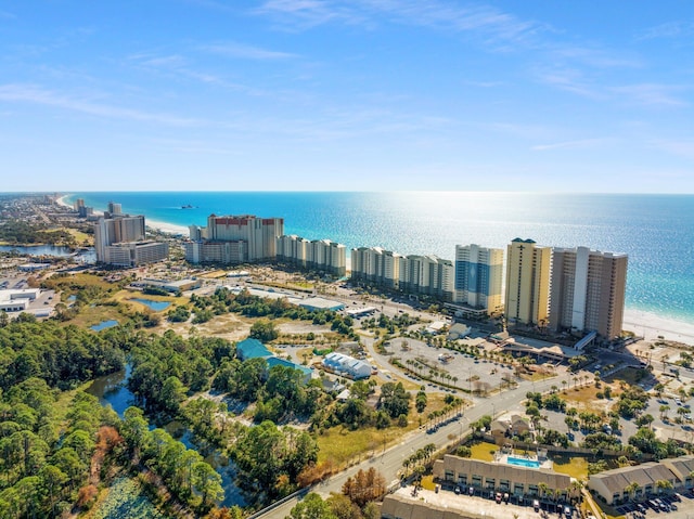 drone / aerial view featuring a city view and a water view