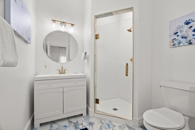 bathroom featuring vanity, a shower stall, toilet, and marble finish floor