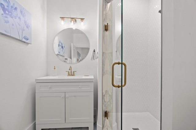 full bath with a stall shower and vanity