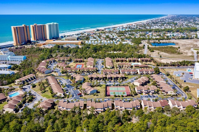 aerial view featuring a water view and a beach view