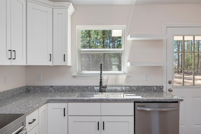 kitchen featuring dishwasher, open shelves, a sink, and white cabinetry